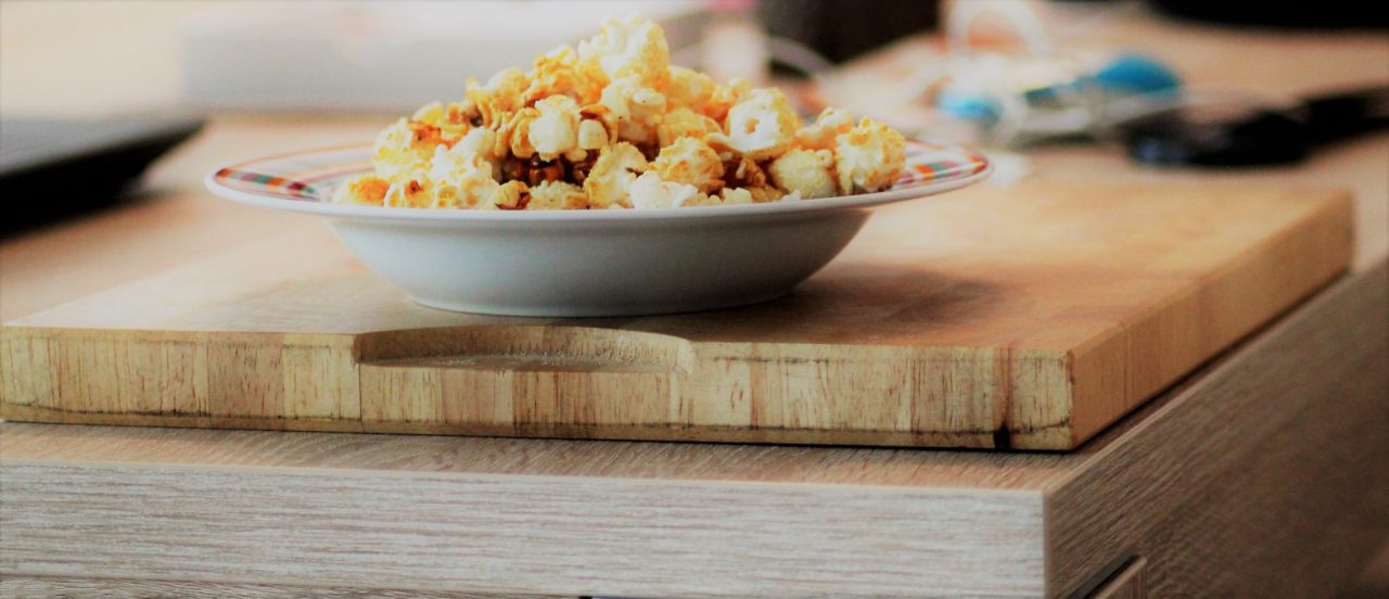 Sweet Popcorn on a wooden table made by the best popcorn popper